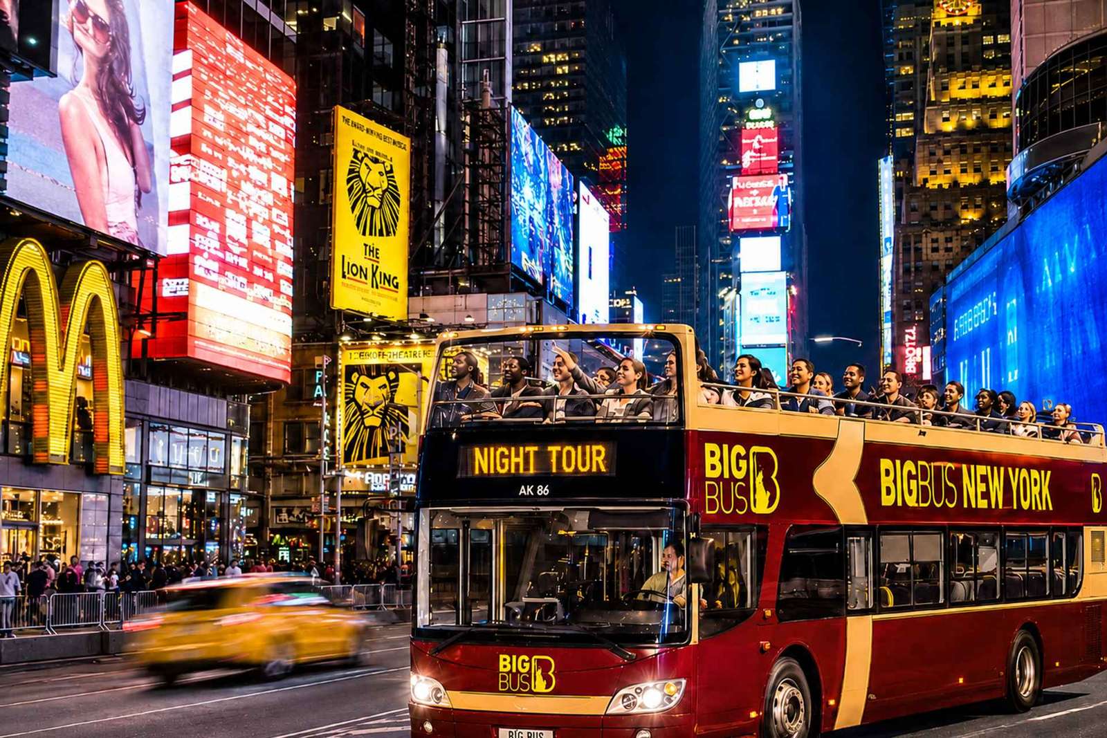 Nueva York: recorrido turístico nocturno en autobús descubierto con guía en directo